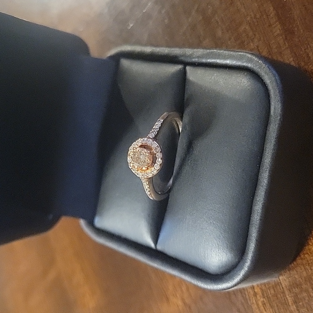 Diamond solitaire halo style ring